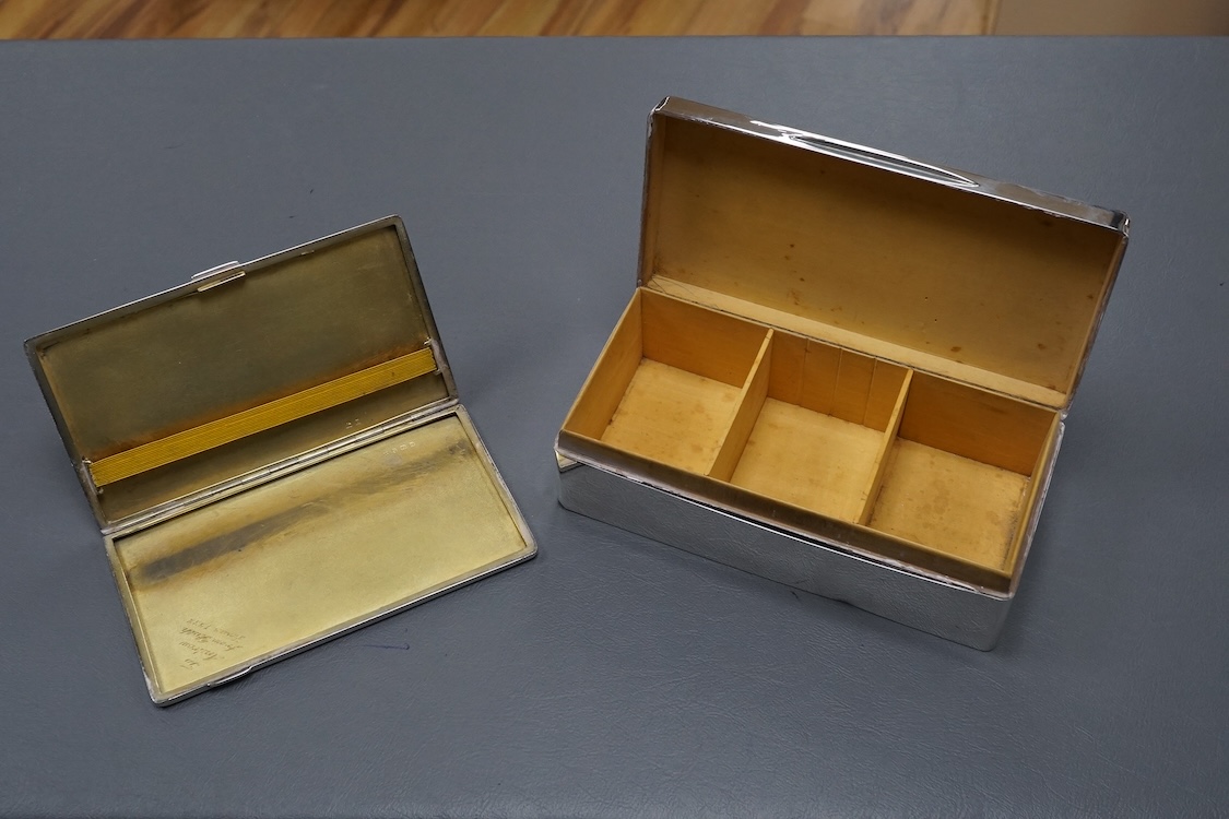 A George V engine turned silver mounted cigarette box, London, 1934, 17.6cm, together with a similar engine turned silver cigarette case.